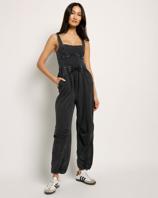 Black $|& Free People Movement Inbound Onesie - SOF Front