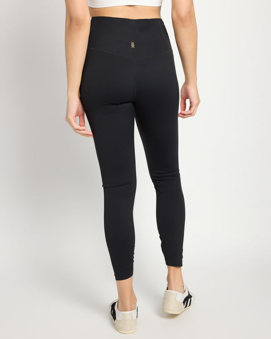 Black/Snow White $|& Rhone Revive Colorblock 7/8 Legging - SOF Back