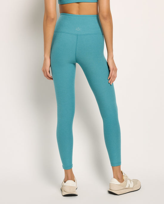 Deep Aqua Heather $|& Beyond Yoga Spacedye Caught In The Midi High Waisted Legging - SOF Back