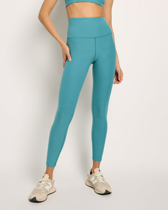 Deep Aqua Heather $|& Beyond Yoga Spacedye Caught In The Midi High Waisted Legging - SOF Front
