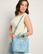 Tranquil Blue $|& Joy Susan Flora Laser Cut Out Crossbody Tote - SOF Front